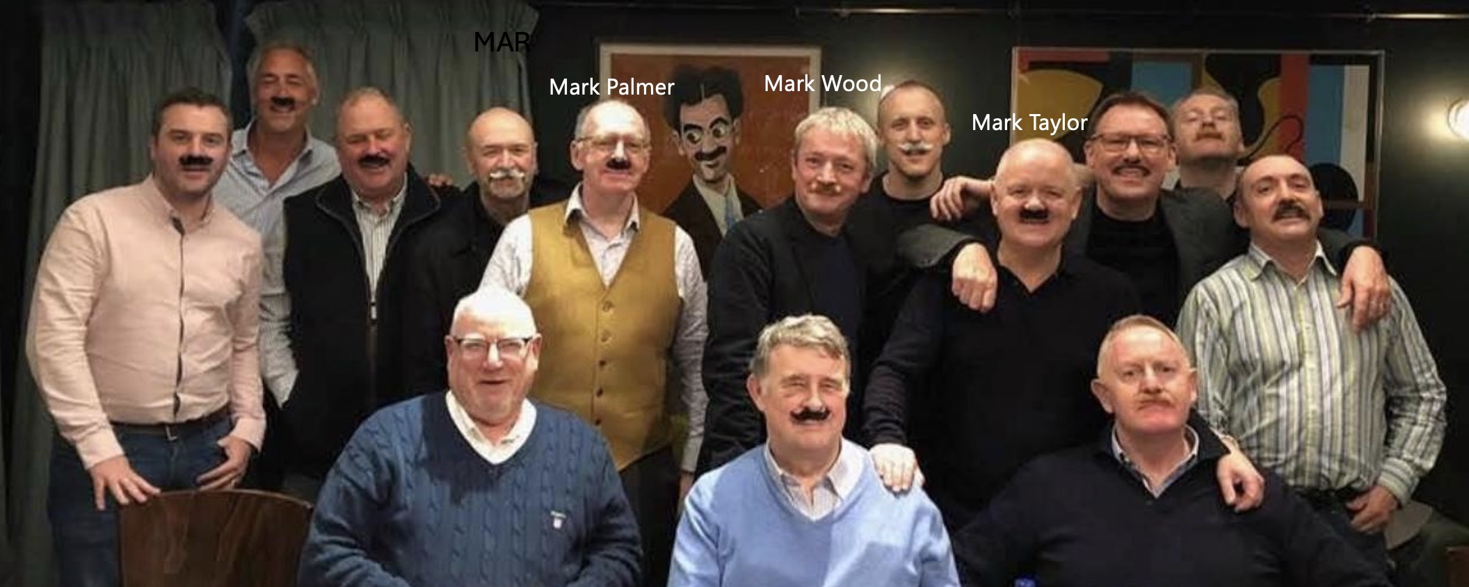 A group of friends named Mark at a pub